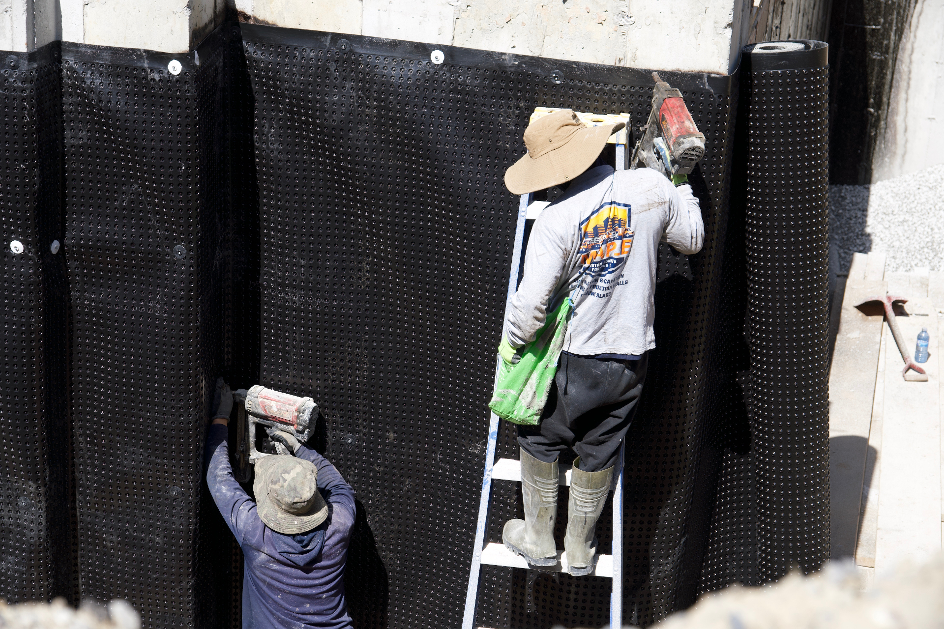 Waterproofing membrane applied to a below-grade foundation wall